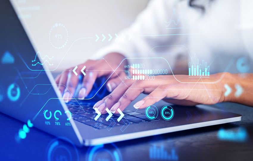 Photo of someone typing on a laptop keyboard