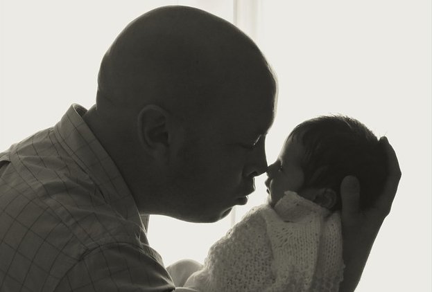 Father embrasing his small child